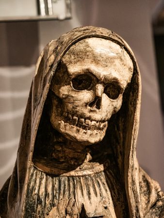Depiction of death in ancient art. Skeleton statue.