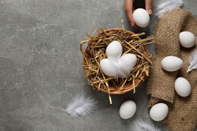 Eggs in a wicker basket, on a gray background.