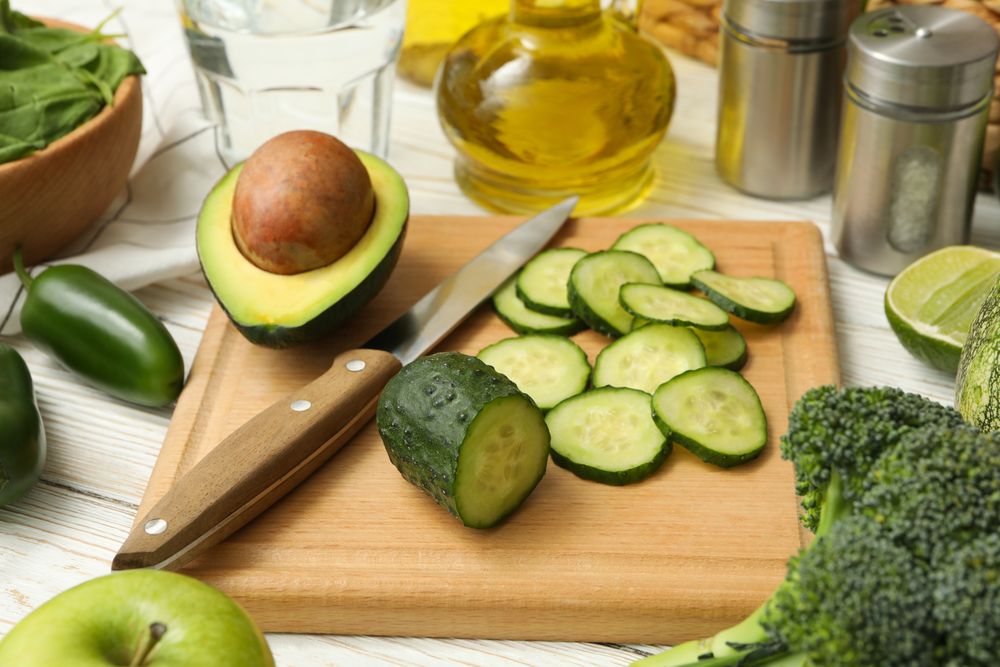 Concept of cooking salad on wooden table