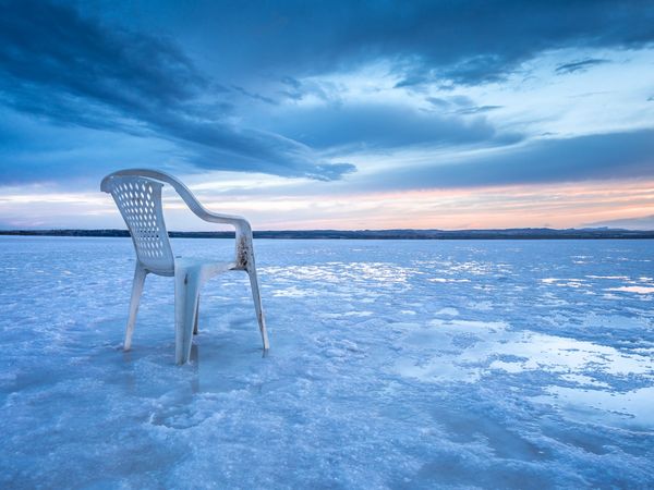 Chair on salt mine during sunset