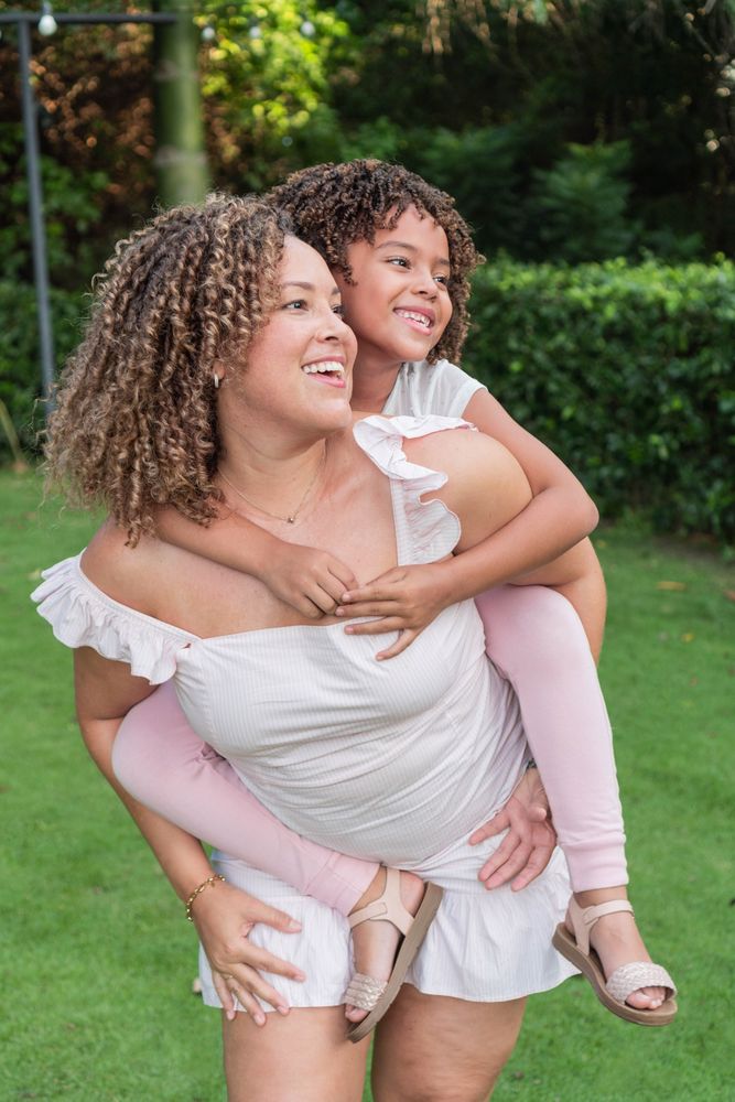 Mother having fun with her daughter at park