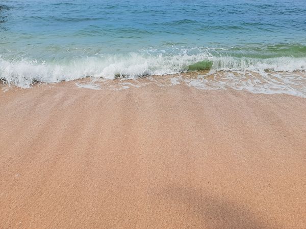 Clean Sandy Beach with Ocean Waves in Angso Duo Island