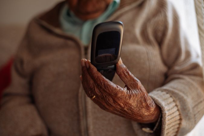 Older person using his phone