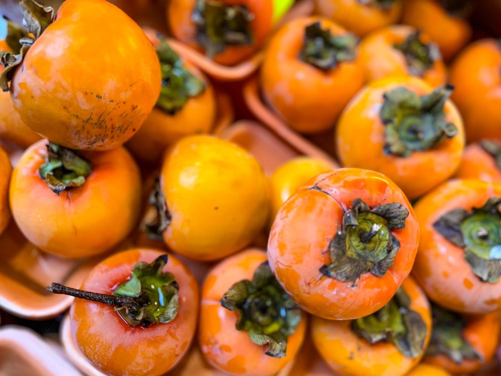 Fresh persimmons for sale at market