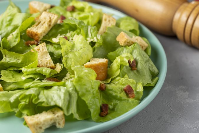 Caesar salad with croutons and bacon.