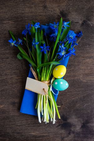 Blue napkin with scilla flowers with decorative eggs