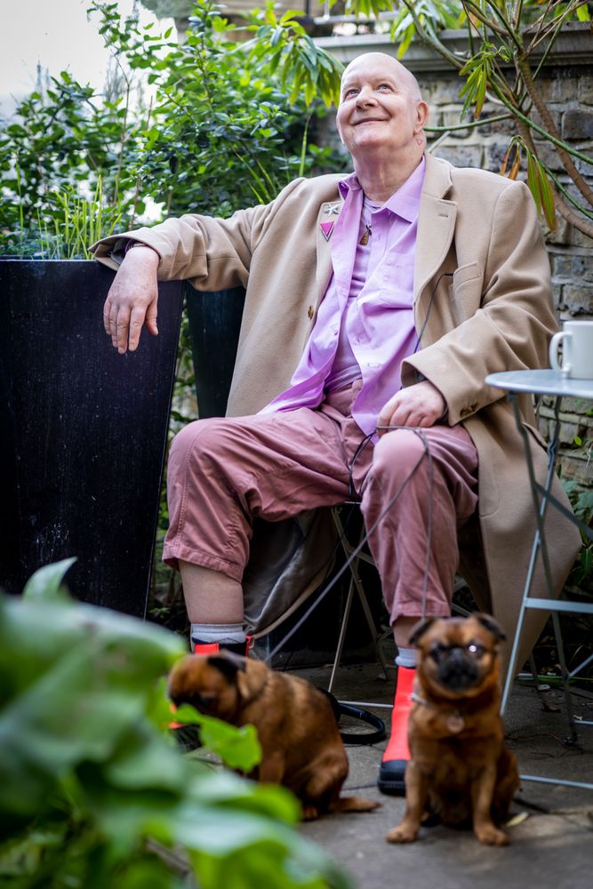 Man in garden with two dogs