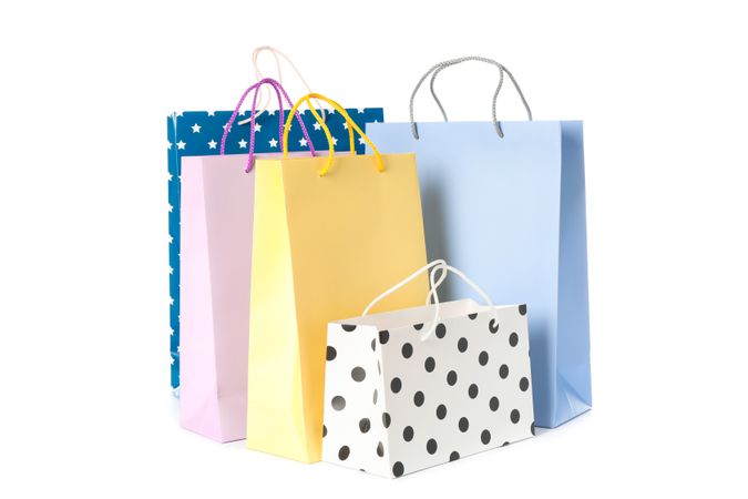 Multicolor paper bags isolated on blank background