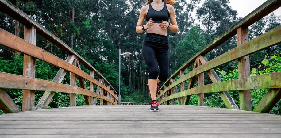 Woman running through an urban park