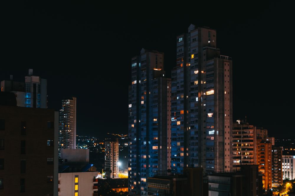 Apartment buildings in city at night