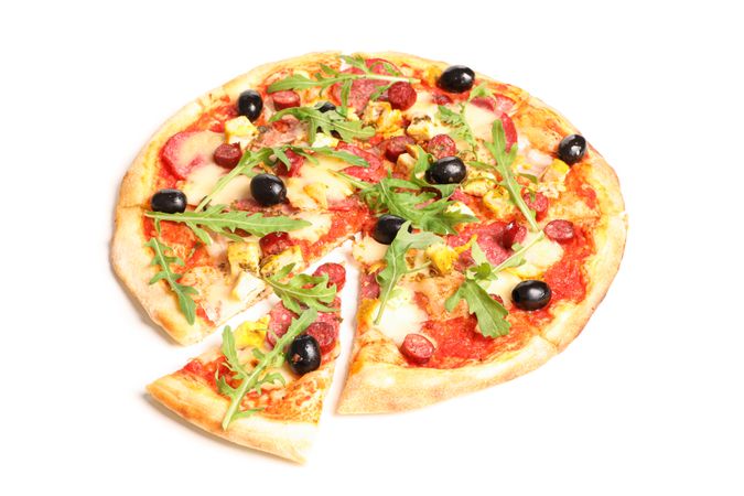 Meat pizza with arugula isolated on blank background