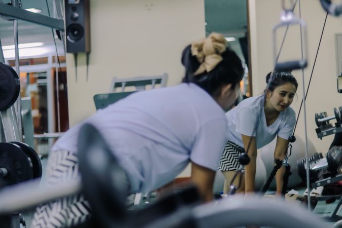 woman in Indonesia exercising in a fitness center