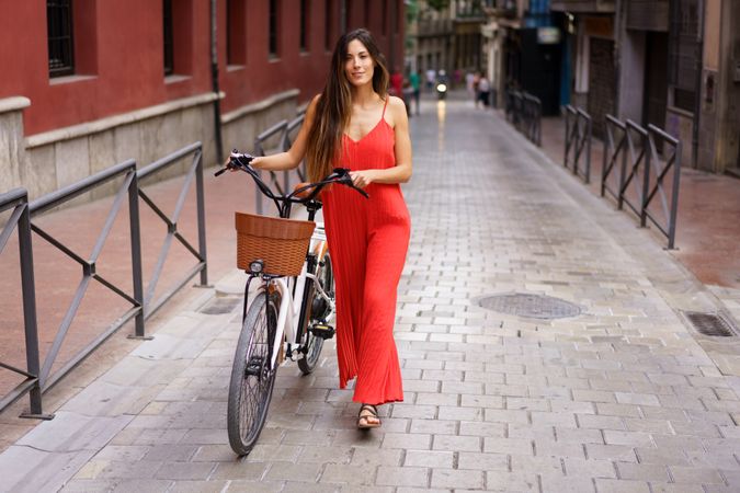 Charming Young Woman Riding an ebike in a Lively Urban Street Setting Full of Life
