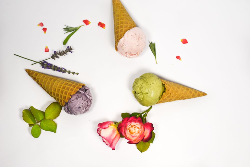Top view of three waffle cones with different ice cream scoops
