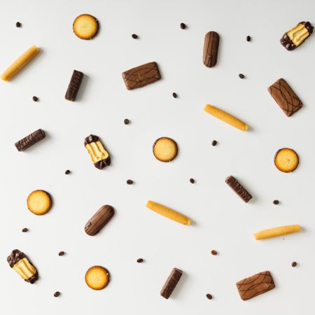 Cookies and coffee bean pattern on light background
