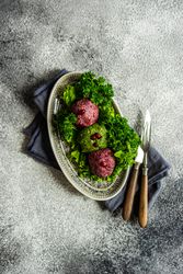 Traditional Georgian dish beet & spinach dish pkhali served on napkin with cutlery