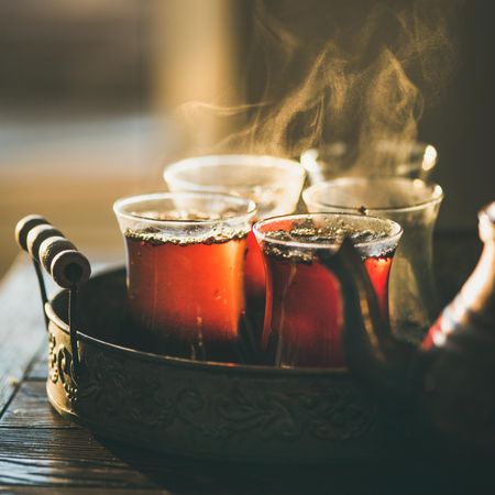Close up of steaming hot tea in glass cups