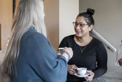 Women having a conversation over a cup of tea