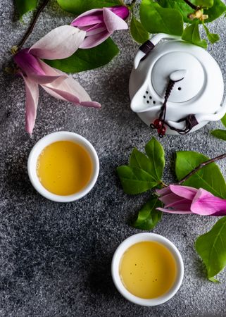Magnolia with green tea and teapot