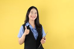 Smiling Young Asian Business Woman  using Tablet Computer