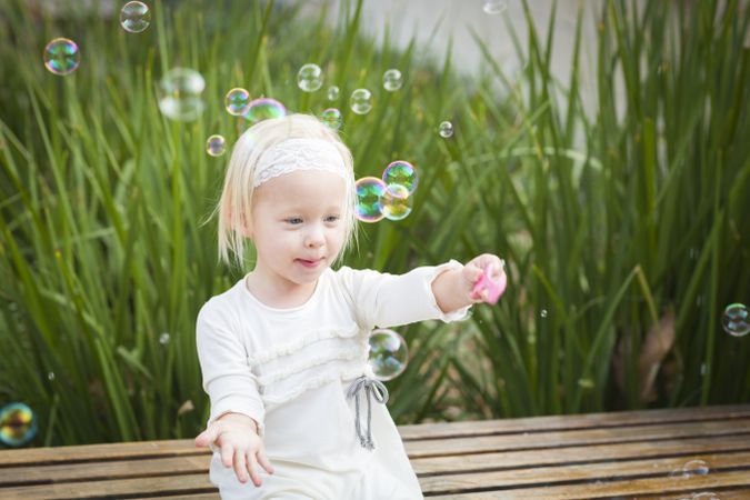 Adorable Little Girl Having Fun With Bubbles