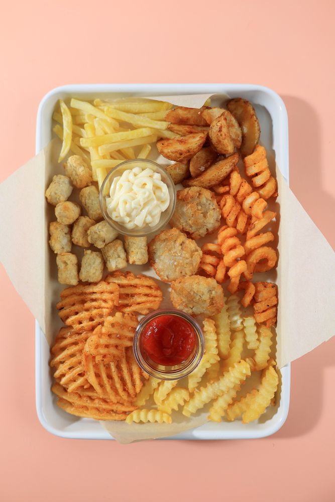 Top View Various Potato Fries with Tomato Sauce and Mayonnaise.