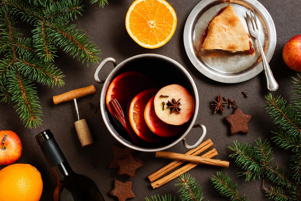 Top view of mulled wine and pie