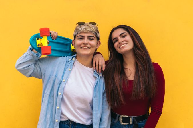 two women with a skate and  smiling