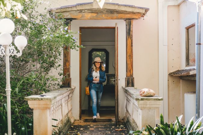 Woman walking on old porch