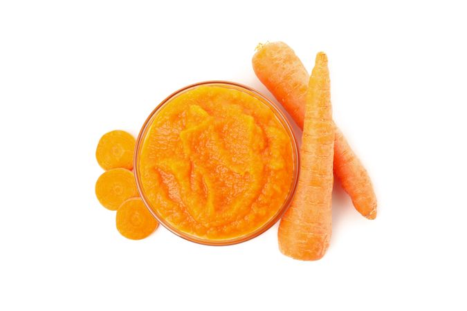 Bowl with healthy baby food isolated on plain background