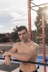 Shirtless man on sports ground