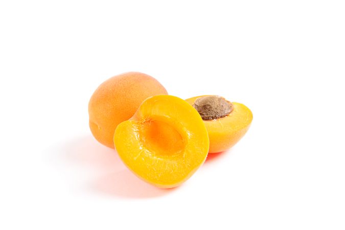 Fresh sweet apricots isolated on blank background