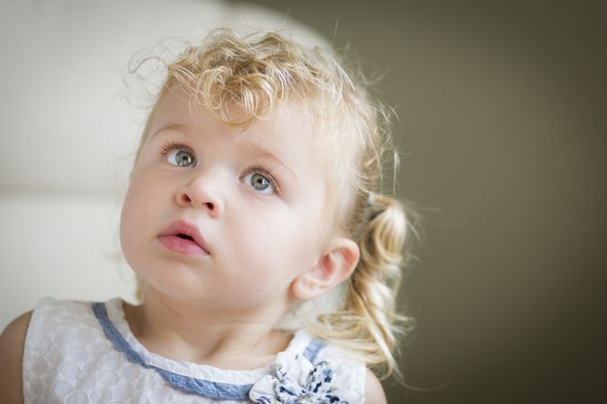 Cute Blonde Little Girl in Chair