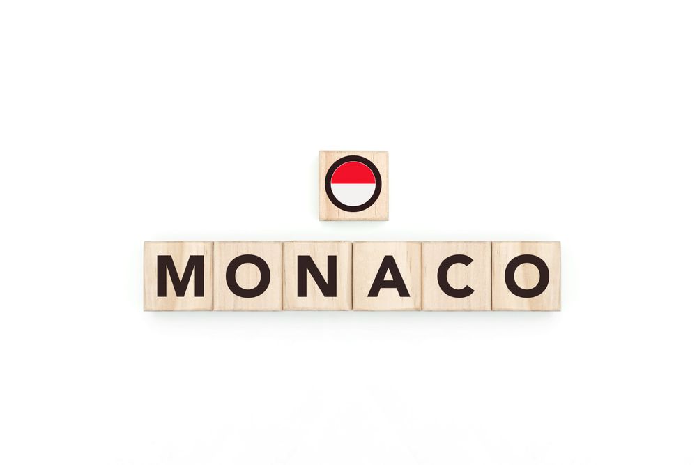 Wooden blocks bearing the name and flag of Monaco.