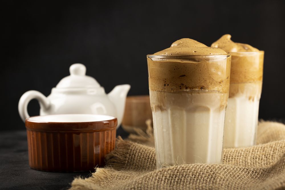 Iced Dalgona Coffee, glass with milk and coffee cream.