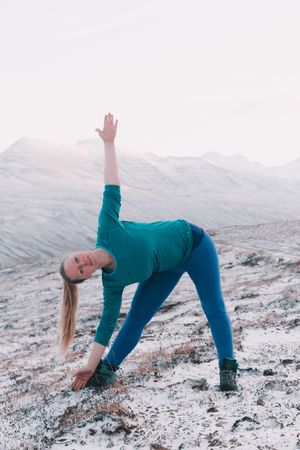 Woman posing on hill in snow