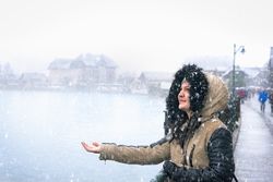 Young woman enjoying the first snow