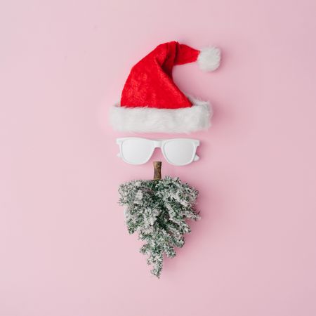 Santa Claus portrait with hipster sunglasses on pink background