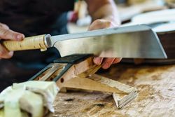 Spanish guitar maker, or luthier, working on a flamenco guitar
