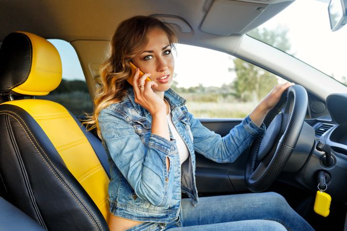 Female talking on cell phone in vehicle