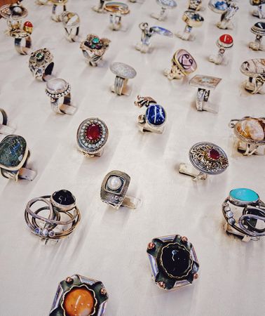 Top view of row of rings with multi-colored gems