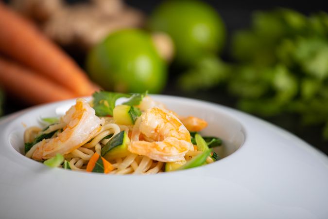 Tasty Pad Thai of vegetables and prawns in white plate