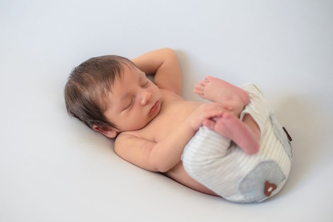 portrait of baby asleep in bed