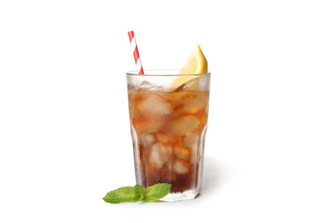 Glass of cold cola with lemon isolated on blank background
