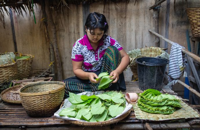 Bagan, Myanmar - June, 25 2012: woman selling flowers on street