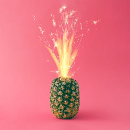 Pineapple with fire sparking at top