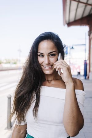 woman talking on mobile phone at street