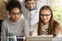 Multi-ethnic male and female students in protective eye wear 0gljM5