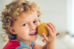 Smiling boy with small ball