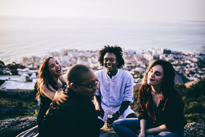 Group of friends having a good time overlooking the ocean